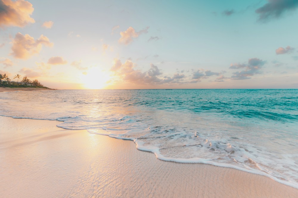 A peaceful beach with soft sand and clear turquoise water
